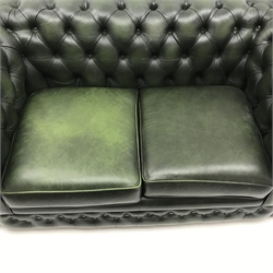  Two seat Chesterfield sofa, upholstered in deep buttoned green leather, bun feet, W164cm  