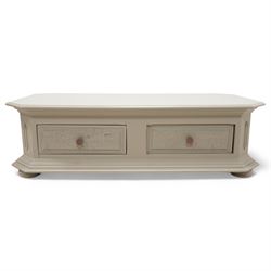 Light grey painted low coffee table, canted rectangular form fitted with two through drawers, on compressed bun feet