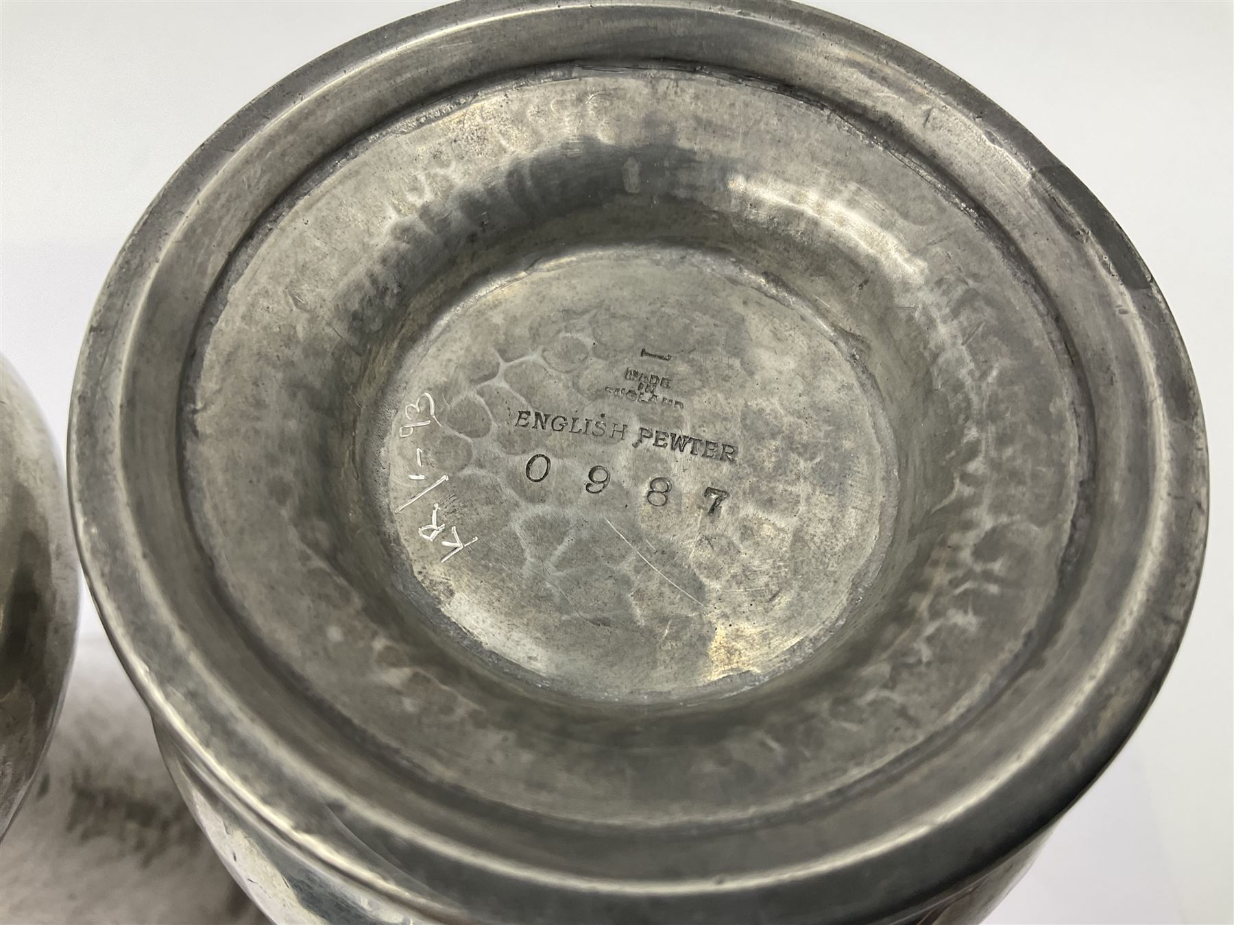 Pair of Liberty & Co Tudric pewter vases, each of bellied form with hammered finish, upon a circular spreading foot, impressed beneath 0987, H12cm
