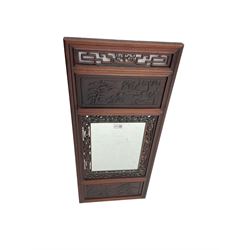 Chinese hardwood framed wall mirror, with pierced and carved decoration and traditional scenes
