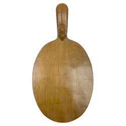 Mouseman - oak cheeseboard, oval form with projecting handle carved with mouse signature, by the workshop of Robert Thompson