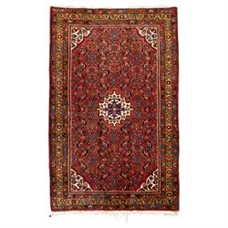 Hamadan hand-knotted rug, red field with small central floral medallion and dense repeatin...
