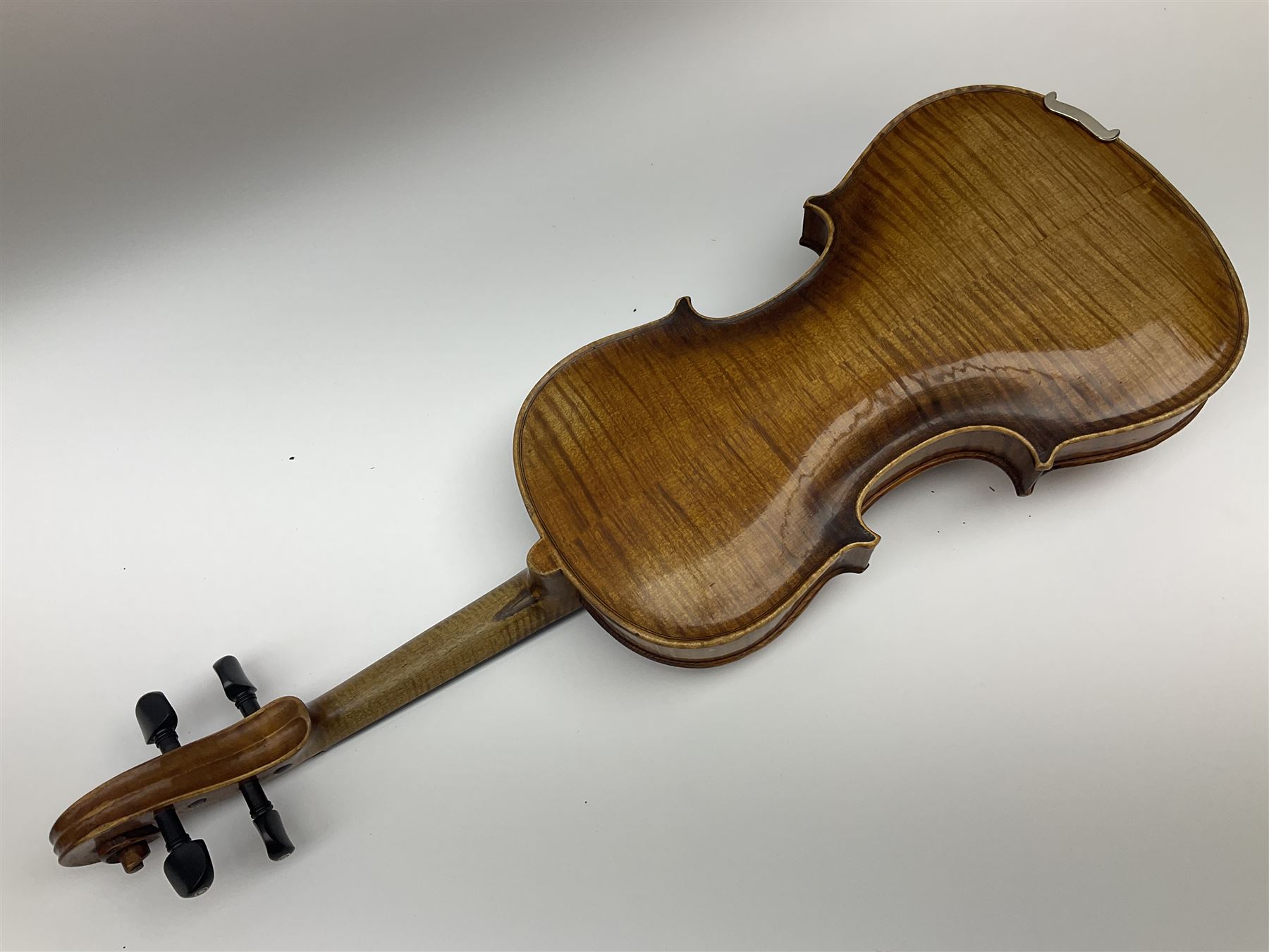 German Saxony violin c1900 with 35.5cm two-piece medium grain maple back and ribs and medium grain spruce top; bears label 'Jacobus Stainer in Absam prope Oenipontum 17xx Made in Germany', 59.5cm overall; with modern bow (2)