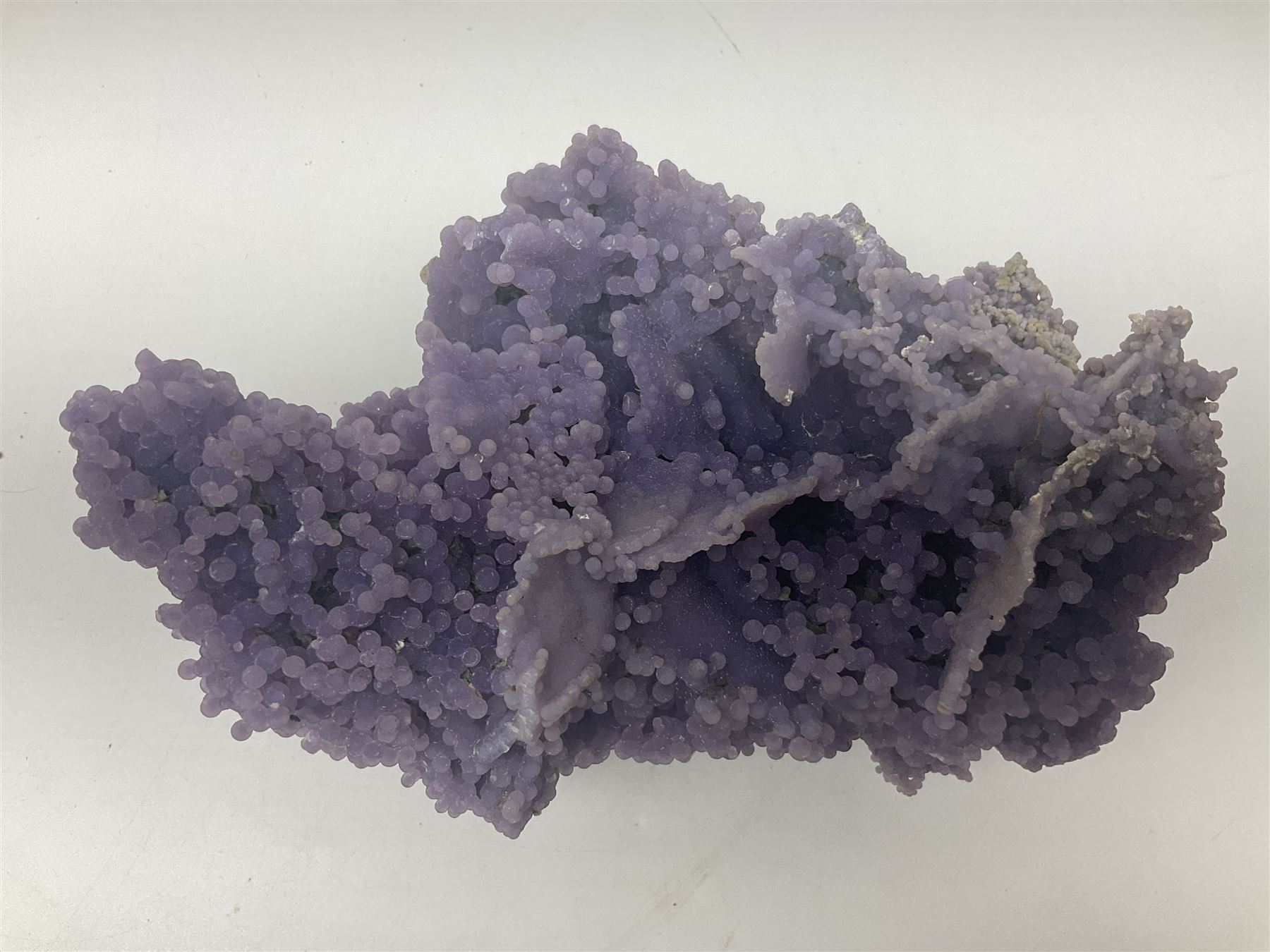 Grape agate cluster, formed of spherical quartz crystals, in purple tones, H15cm, L20cm