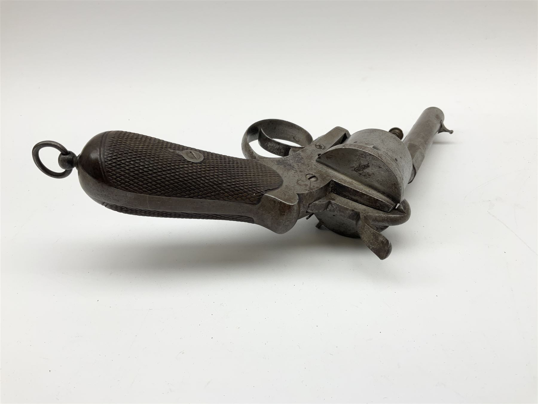 Mid-19th century 12mm (approx. .45cal.) six-shot pin fire revolver with single and double action, bears English proof marks, rifled barrel, fitted ejector rod and chequered walnut split grips L25cm