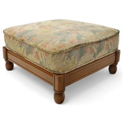 Ercol – bergère four piece suite, including armchair, two seat sofa, three seat sofa and footstool, all with removable floral upholstered cushions, the frames with side caning and rounded arm supports in stained beech

Three seat (H 87cm, D 89cm, W 196cm)
Two seat (H 87cm, D 89cm, W 137cm)
Armchair (H 87cm, D 89cm, W 87cm)
Footstool (H 28cm, D 55cm, W 55cm)