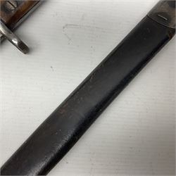WWI British Pattern 1907 bayonet with 42cm fullered steel blade and two-piece wooden grip; various marks to ricasso including date 12 -?7; in leather and steel mounted scabbard L57cm overall