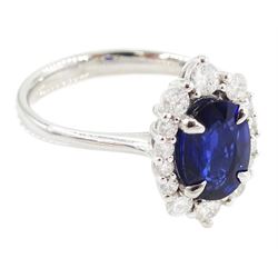 14ct white gold sapphire and diamond cluster ring, single oval cut sapphire of approx 1.00 carat, with round brilliant cut diamond surround, total diamond weight approx 0.40 carat