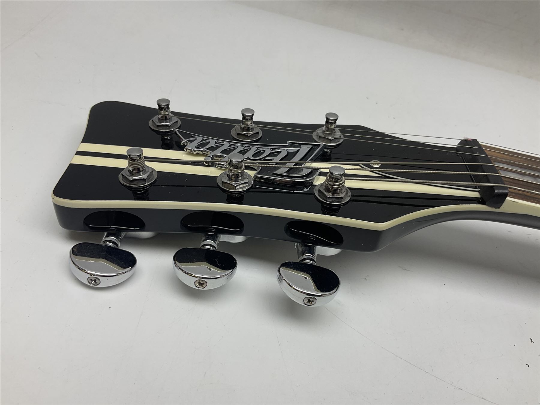 Italia Maranello Speedster electric guitar in black and white, serial no.013972; L99cm; in Italia soft carrying case; together with a boxed TGI 3491 guitar stand