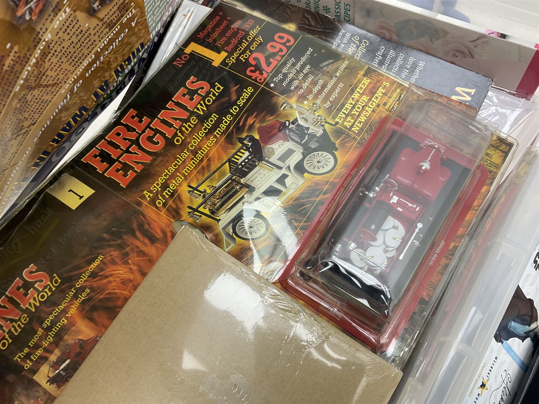 Two Compare the Meerkat meerkat dolls comprising Batman and Star Wars, Ted 2 stuffed doll, quantity of boxed bobble heads, and quantity of magazines with models to include Men At War, Fire Engines of the World etc in three boxes