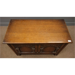  Early 20th century oak chest, hinged lid, double arched front carved with foliage, stile supports, W92cm, H61cm, D46cm  