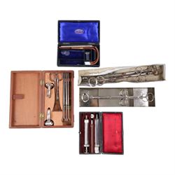 Collection of early 20th century and later medical equipment, including portable inhaler, tonsil guillotine, aspirator, steel catheter set, etc, in leather boxes
