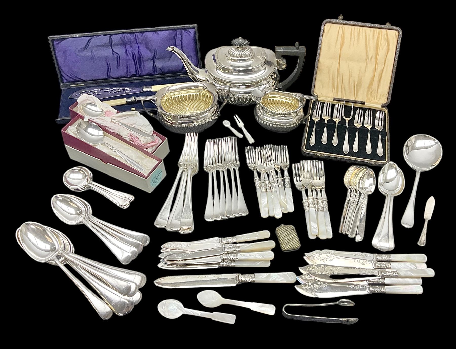 Mother of Pearl handled cutlery, with silver ferrules, comprising six fish knives and forks and six fruit knives and forks, the ferrules hallmarked Yates Brothers, Sheffield 1905, together with silver plated Edwardian three piece tea service and other flatware 
