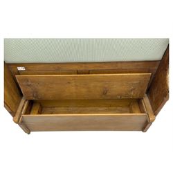 Early 20th century waxed pine pew, inset upholstered striped back panel with hinged box seat enclosing storage, shaped arms and turned supports