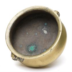 Chinese Ming dynasty gilt bronze censer, of circular bellied form with temple lion mask handles, upon a circular foot, six character Xuande mark to base, D15.5cm