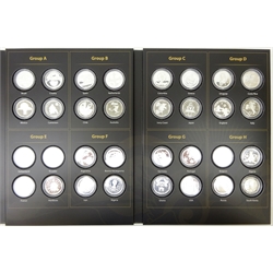  'The Official Silver Commemorative Medals of the 2014 FIFA World Cup', all thirty two silver medals in capsules, in official folder which has not been written in  