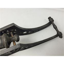 Victorian cast-iron and steel signal cannon, approximately half-inch bore, with 23cm ringed barrel and cylindrical trunnions, on a cast iron carriage with two twelve-spoked wheels and guilloche pierced swept back support, L43cm overall