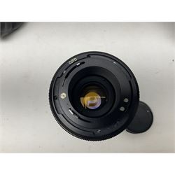 Canon A1 35mm camera body serial no 741264, with 'Tokina AT-X 28-85mm 1:3.5-4.5' lens serial no 821679, 'Canon FD 50mm 1:1.8mm' lens and other camera equipment 