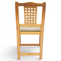 Beaverman - 1980s set of four lattice back dining chairs, shaped top rail above a lattice back, green leather fixed seat, raised on octagonal front supports, with carved Beaver to the back stretcher, by Colin Almack of Sutton near Thirsk