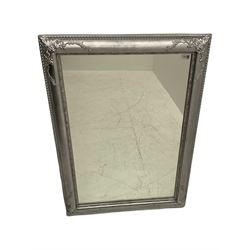 French style rectangular mirror, in rounded silvered frame decorated with scroll foliage and beading 