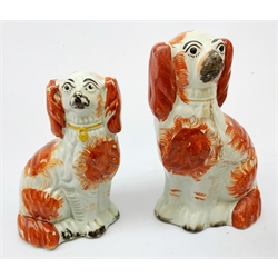  A late 19th century Staffordshire money box, modelled as a country house, H13cm, together with a Staffordshire spill vase modelled as a tower, and four various Staffordshire mantle dogs, largest H26.5cm  