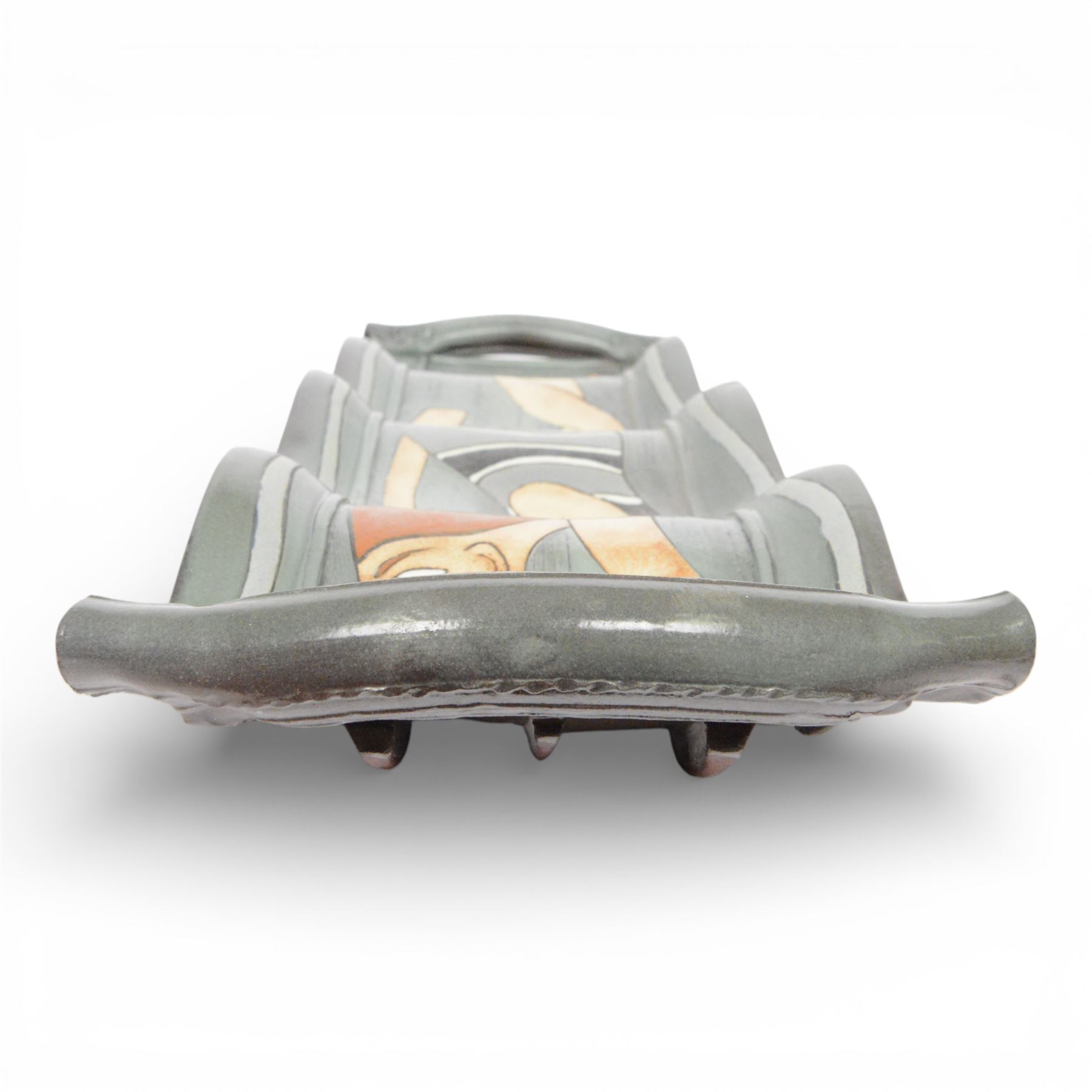 Studio pottery twin handled platter, of waved form, decorated with a female swimmer, L84cm, D22cm