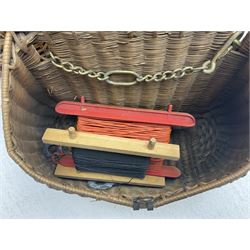 Fishing tackle and accessories housed in two wicker creels, including a landing net, fly tin, small brass reel, other reels to include two Intrepid Boy'o examples, crab lines etc 