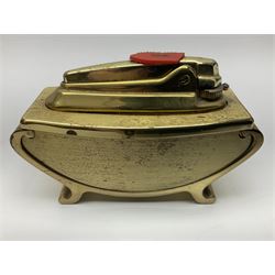 Ronson gilt metal table lighter, together with a silver-plate table lighter in the form of a football boot