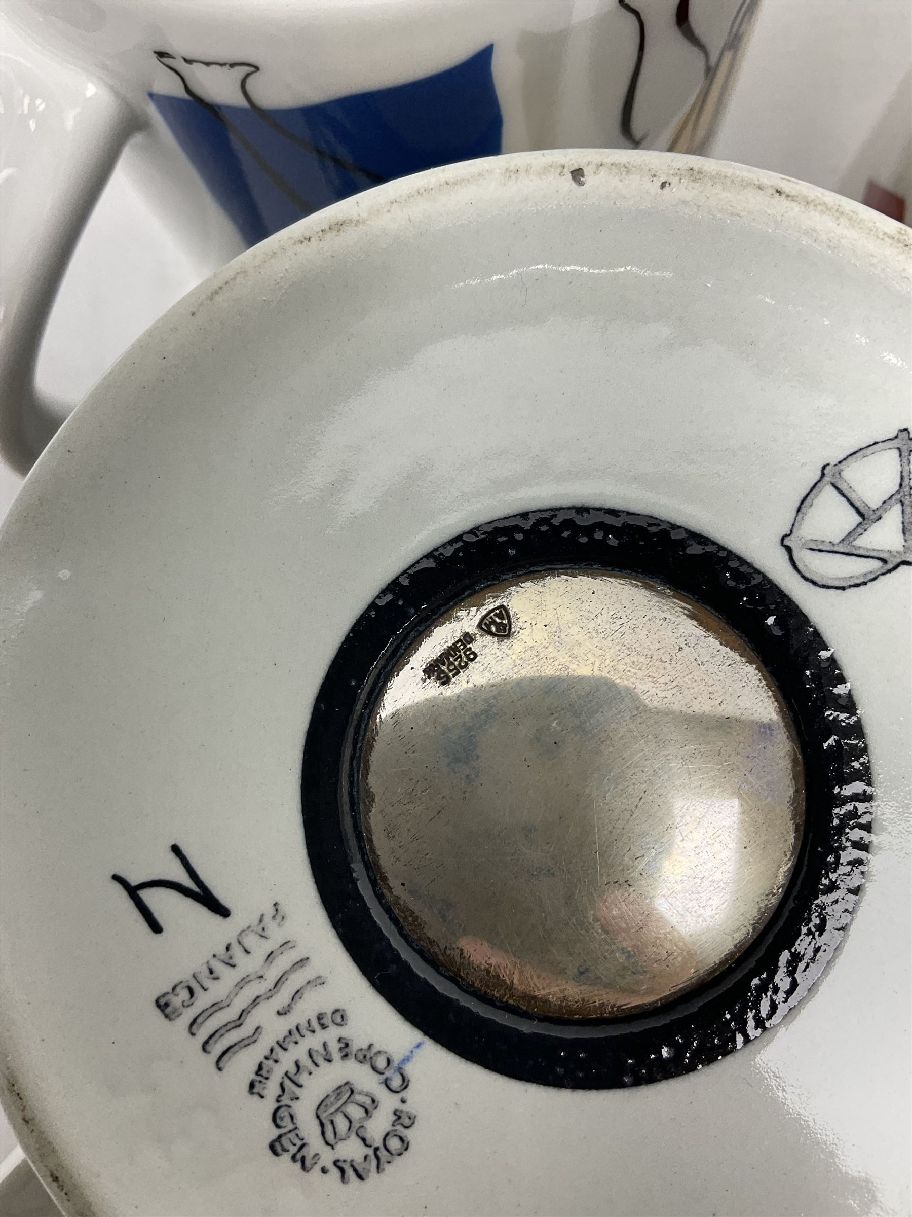 Set of three Royal Copenhagen year mugs, comprising 1976 with silver plaque stamped 925 beneath, and two 2000 examples, H11.5cm