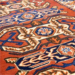 Two rugs, small Bokhara-type rug, terracotta ground with repeating hooked lozenge medallions enclosed by geometric borders (H 120cm, W 83cm); and a cream-ground rug, central lozenge medallion with geometric spandrels and border motifs (H 145cm, W 101cm),