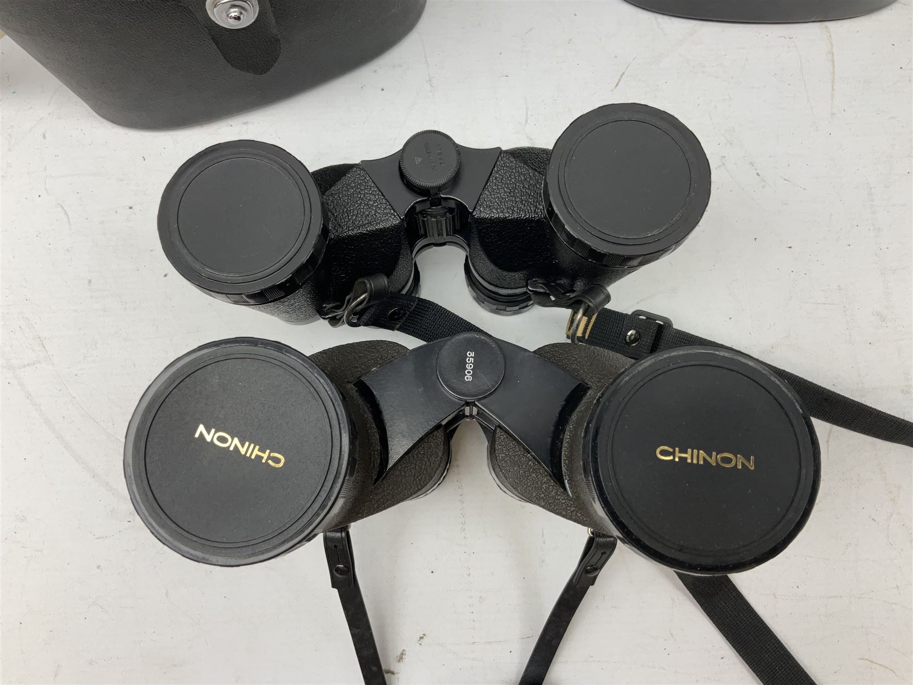 Eleven cased pairs of binoculars to include Summit 8x30,  Concord 8x40, Tasco no. 106 8x - 16x40, Chinon 10x50, Tokina 7x42 Field, Zoom 6x- 12x32 etc