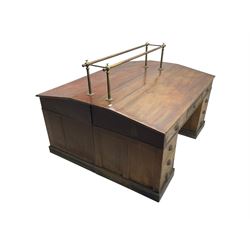 Large late 19th century mahogany double partners or banking desk, the sloped top fitted with brass railings, fitted with nine drawers on each side, on plinth base