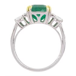 18ct white gold emerald cut emerald ring, each side set with round brilliant cut and baguette cut diamonds, with diamond set shoulders,  stamped 750, emerald 4.77 carat, with World Gemological Institute report
