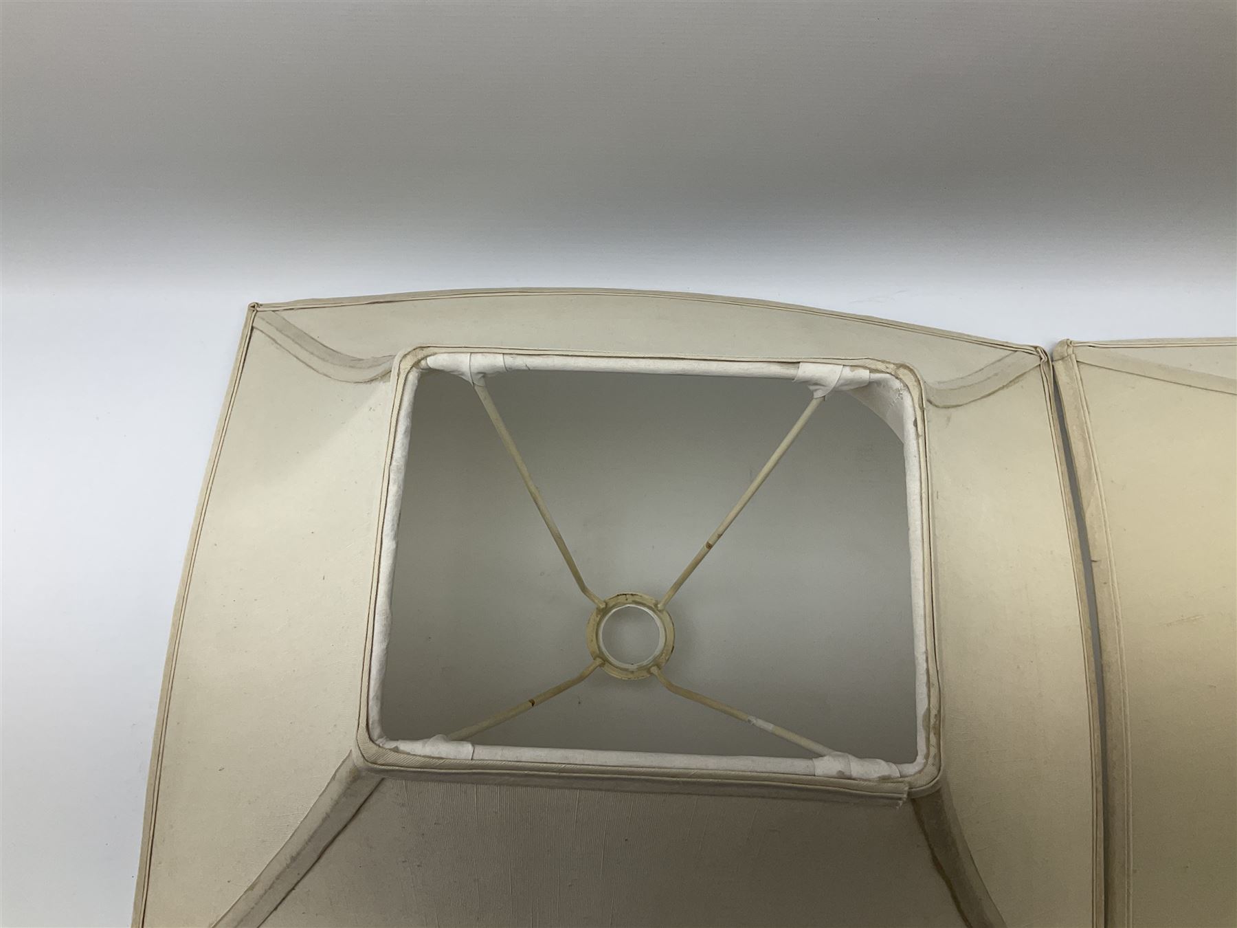 Pair Oriental table lamps decorated with birds in a tree with fruit, on a red ground with a gilded base together with cream lampshades H57cm, without lampshade. 