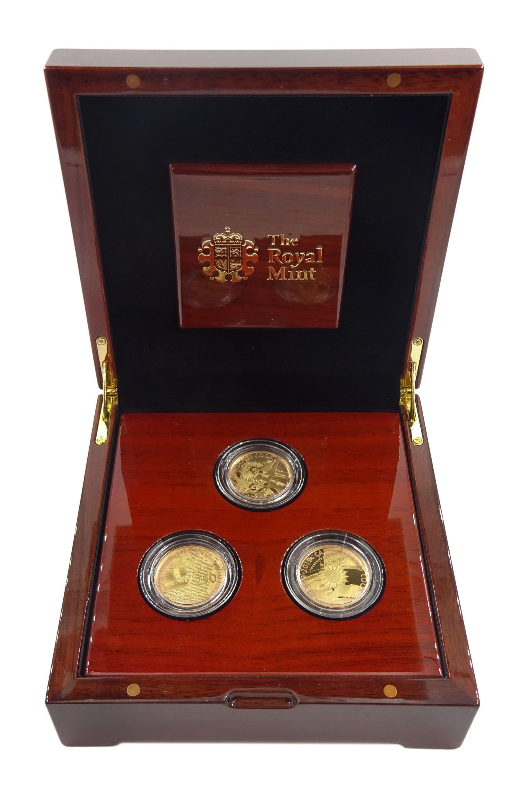 Captain Cook gold proof three coin series, comprising 2018, 2019 and 2020 dated gold proof two pound coins, all three housed together in a Royal Mint presentation box, the individual boxes and certificates are also present