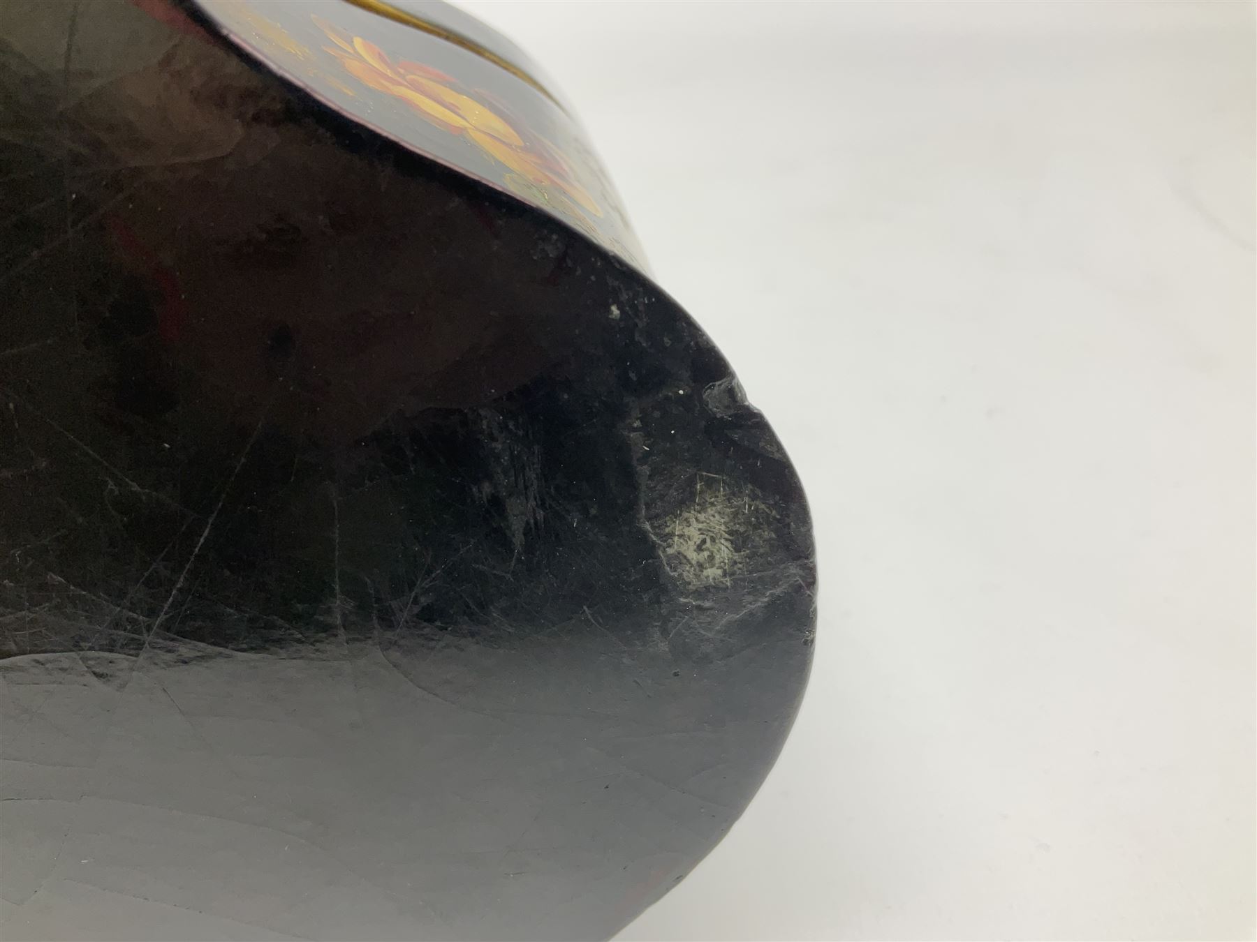 Victorian papier-mâché stationary box, of rounded wedge form with mother of pearl escutcheon, the hinged and curved cover and sides hand painted with floral sprays, opening to reveal a lined and fitted interior, H15cm L22cm D16cm