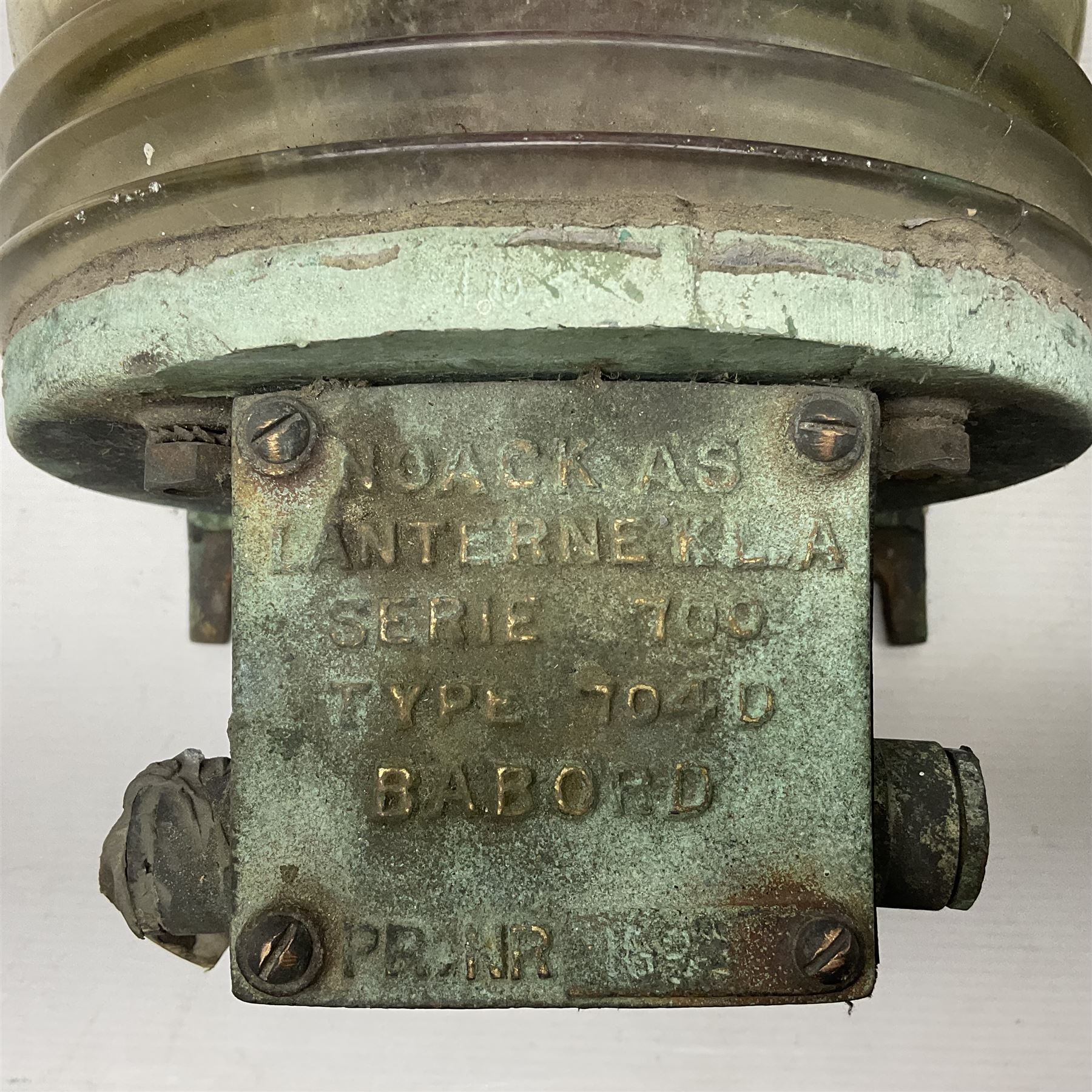 Two port and starboard brass lamps, each with a plaque marked 'Noack as Lanterne KL.A Serie 700 Type 704D Babord', ribbed green and red glass shades, H44cm