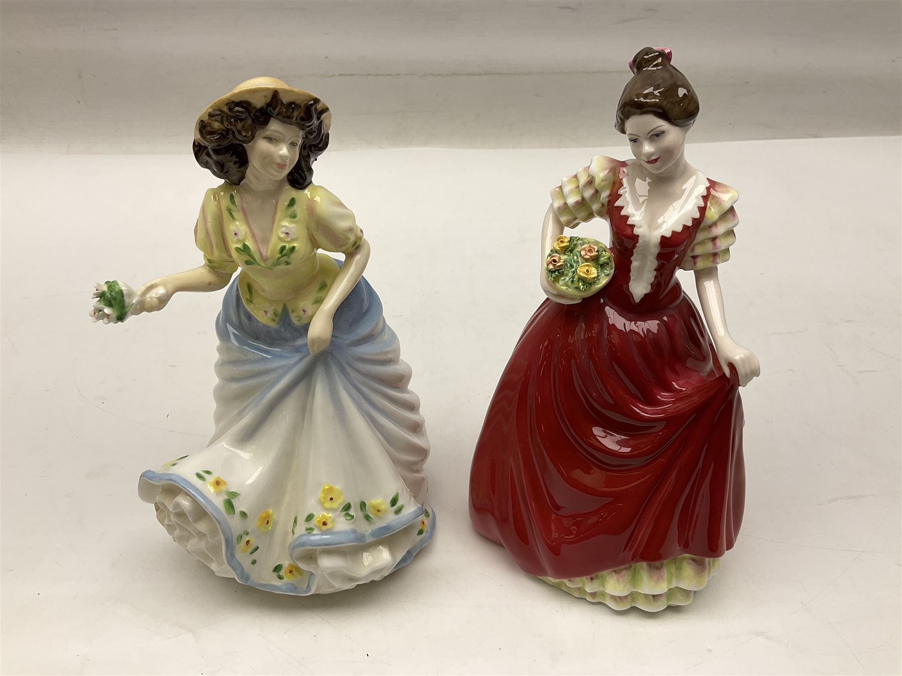 Five Royal Doulton figures, comprising Flower of Love HN3970, Emily HN3688, Southern Belle HN2229, Helen HN3886 and My Love HN2339, all with printed mark beneath, some with boxes, together with a Royal Doulton Figures reference book by D Eyles and R Dennis