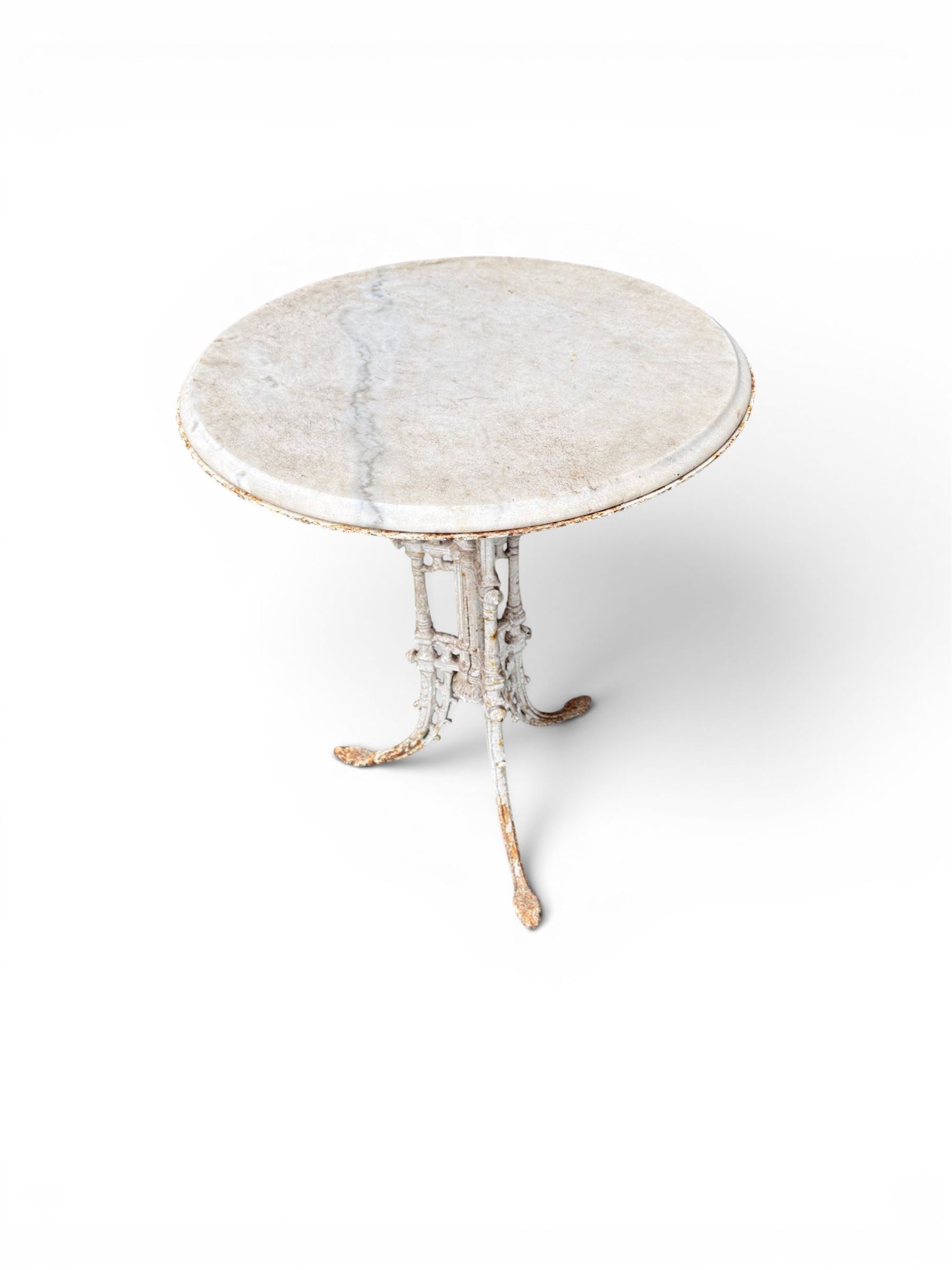 Victorian ornate cast iron garden table, trefoil base with central enclosed column, circular top with later marble, with registration mark