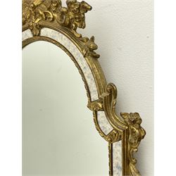 Pair late 20th century gilt Venetian style pier glass mirrors, the ornate shell and floral pediment over arched cushioned frame, inner bead slip, foliate decorated brackets