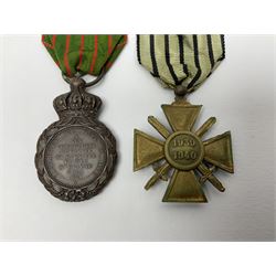 Four French medals - St. Helena medal with bust of Napoleon to obverse and inscription to reverse 'Campagnes de 1792 a 1815. A ses compagnons de gloire sa derniere pensée Ste. Hélène 5 Mai 1821', established by Emperor Napoleon III in 1857; two WW2 Croix-de-Guerre; and WW2 Croix-du-Combattant; all with ribbons (4)