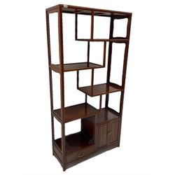 Chinese hardwood curio stand, fitted with four staggered shelves, double cupboard and drawer. W92cm, H182cm, D36cm
