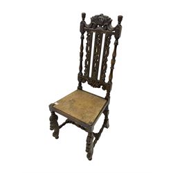 Late 19th century heavily carved oak hall chair, shaped cresting rail with boar masks, the high back with turned supports and C-scrolls with pierced slats, front supports carved with scaled dragons, united by turned stretchers