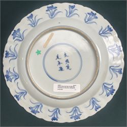 Chinese Kangxi style blue and white plate, decorated to the centre with a hunting scene  of two hunters on horse back, surrounded by a foliate boarder, with with six character double ring mark beneath