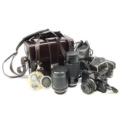 Olympus OM2 camera, 'no.264258', fitted with Olympus 'OM System G.Zuiko Auto-W 1:2.8 f35mm' lens and two other lenses, in a carry case