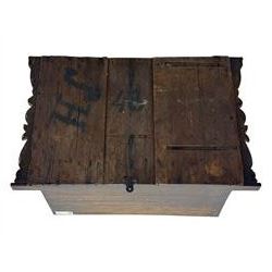 18th century and later carved oak cupboard, enclosed by panelled door carved with central bird motif and scrolled leafage with an outer ebony band, the frieze and uprights carved with repeating lunette and floral designs, flanked by scrolled foliate carved upright brackets