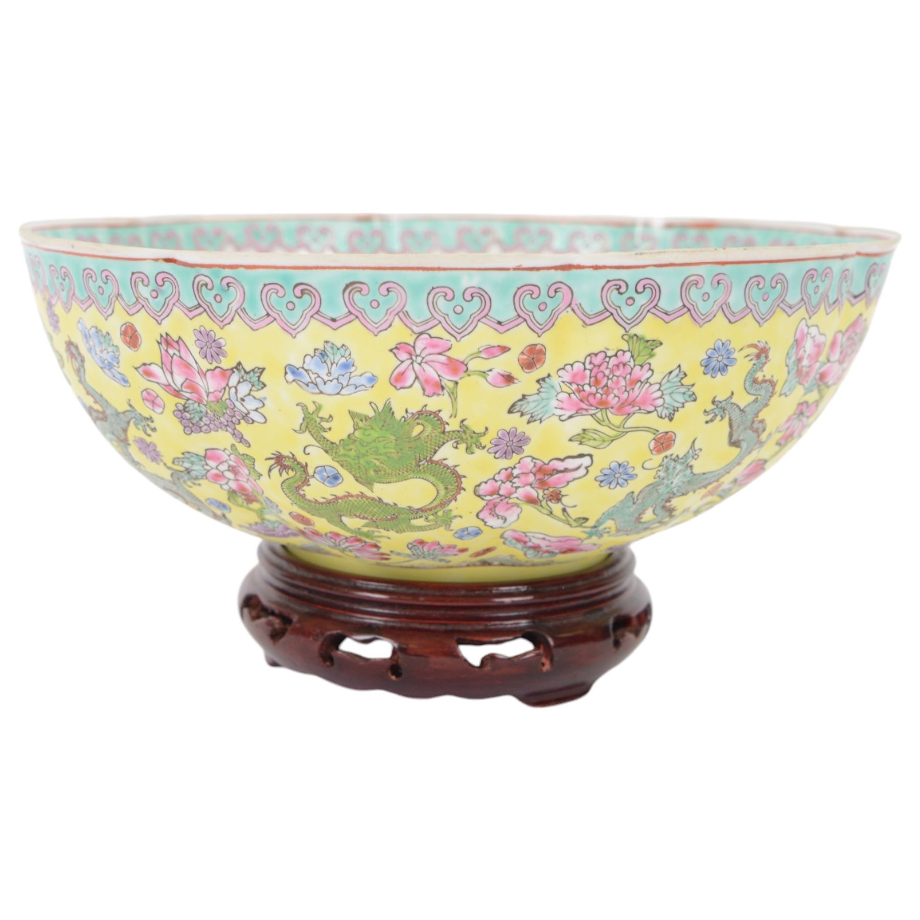 Chinese famille jaune eggshell porcelain bowl, decorated with dragons and foliage, upon hardwood stand, D26cm