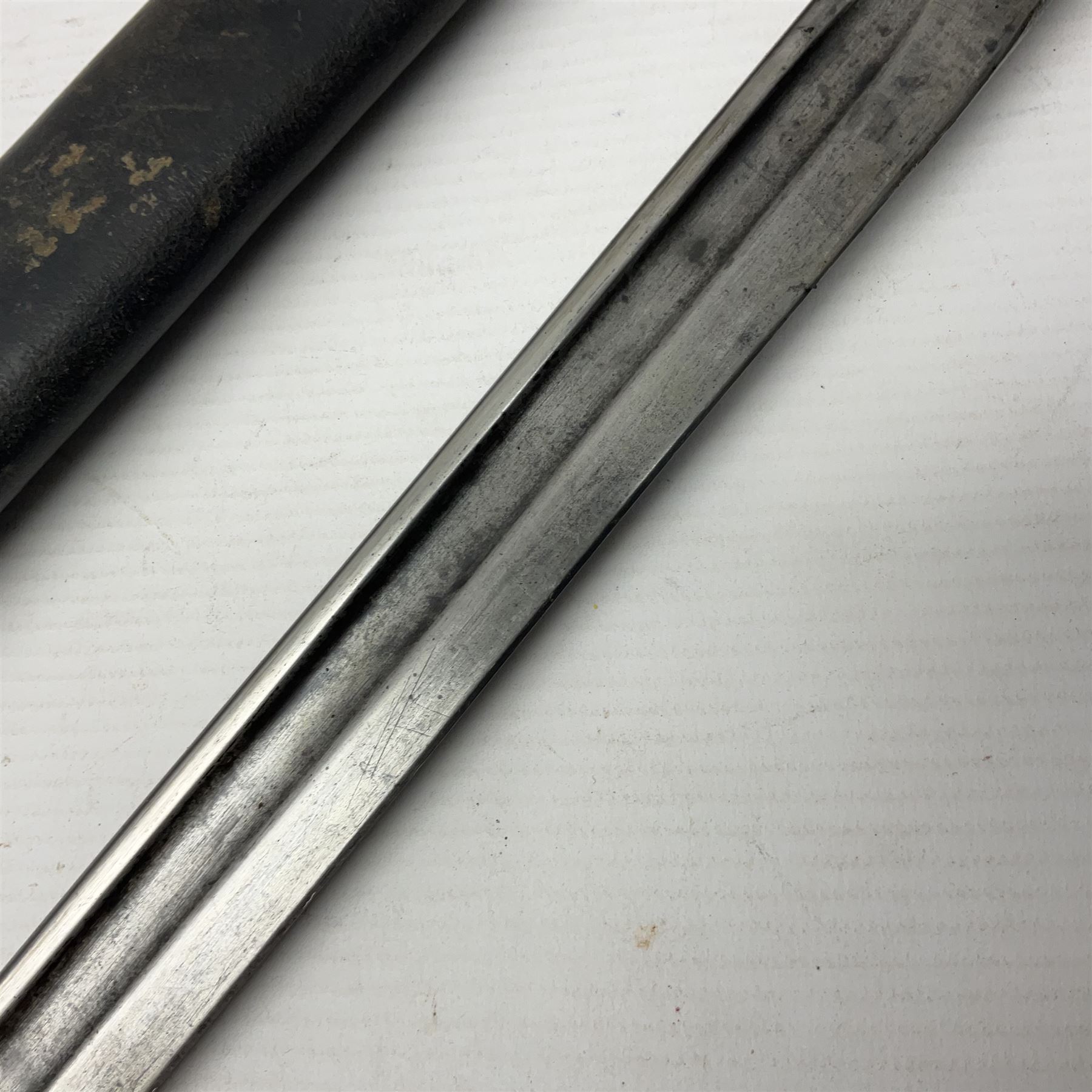 WWI British 1907 pattern bayonet, the 43cm fullered blade by Wilkinson with various marks to the ricasso; in leather covered scabbard numbered 294 to the throat and stamped M/58 L58.5cm overall