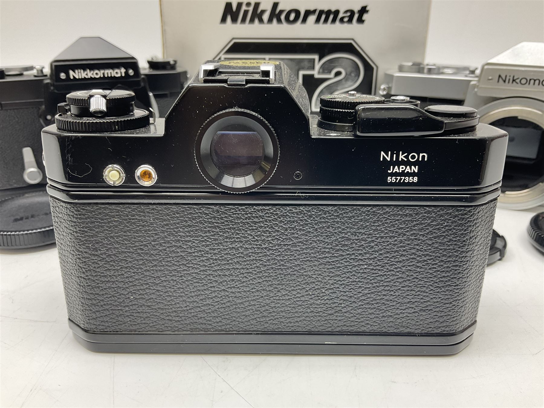 Nikkormat FT2 camera body, serial no. 5066813, in original packaging, together with Nikkormat EL camera body, serial no. 5577358, with Nikon Nikkor 50mm 1:1.8' lens no. 2143575, Nikkormat FT, serial no. 3968385, and Nikomat FT camera body, serial no. 4015491