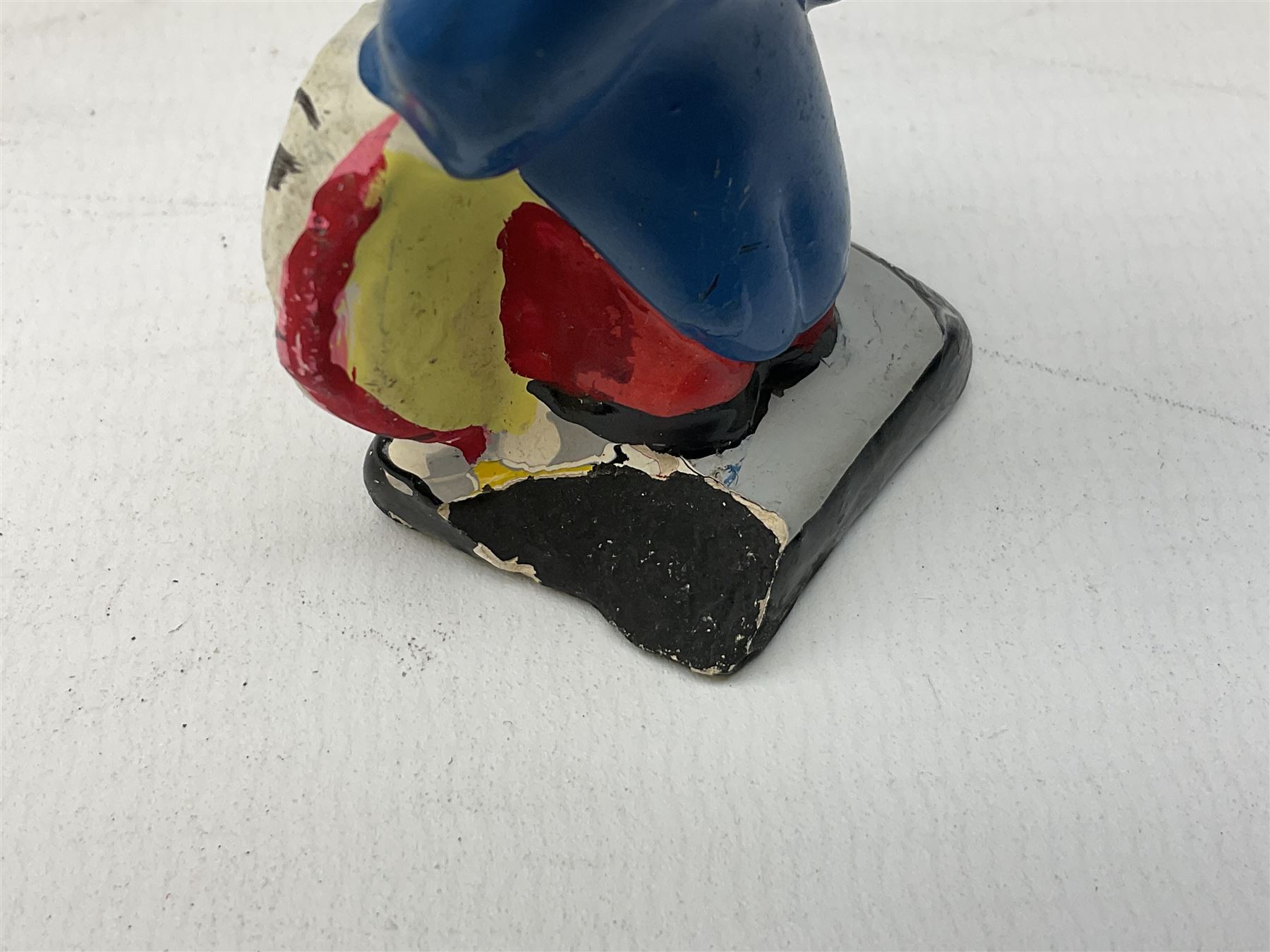 Robinson Jam plaster Golly band, including drummer and singer, H7.5cm

Originally handmade by mothers in Africa for their children from old fabric and cloth, the golly doll was adopted as the mascot and trademark for the Robertson's confectionery brand around 1910 after the company's founder John Robertson visited the US and noticed children playing with them. Robertson's Gollies have been collected by people across the UK and around the world for generations but garnered a contentious image in the 1980s because of links to racism. The trademark was removed from Robertson's branding in 2001.